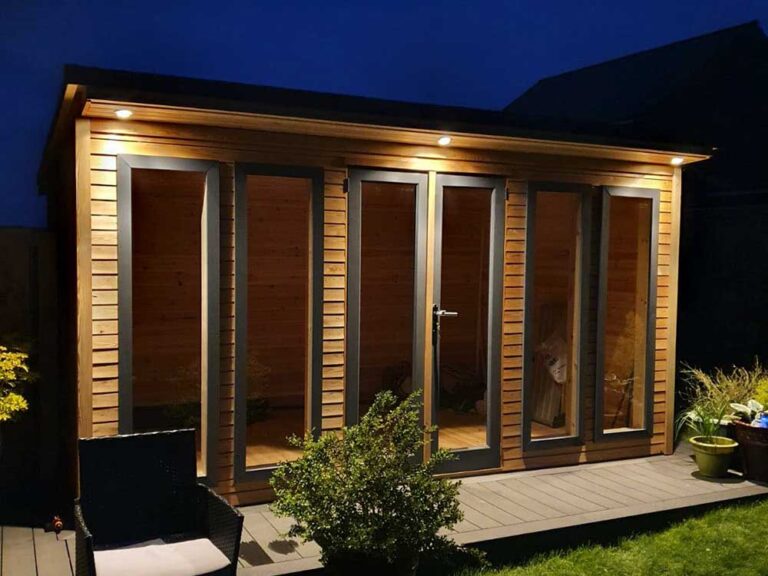 A Hardwick garden room with vertical windows and French-style doors.
